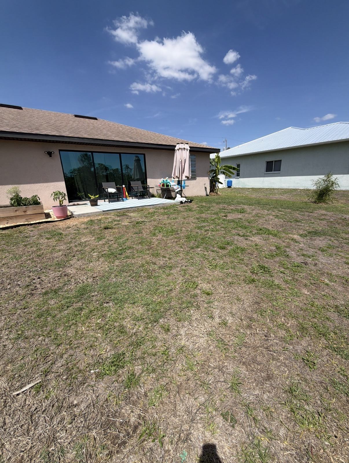 Backyard before a Crete Concepts concrete patio