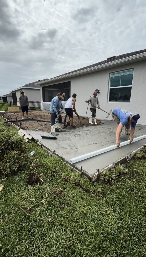 Pour day: placing and screeding a patio, Crete Concepts crew in Southwest Florida