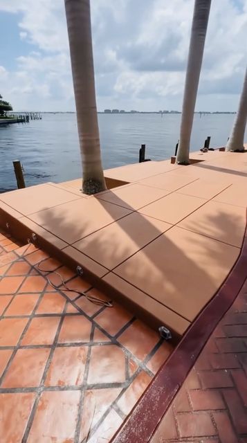 Waterfront deck along the seawall by Crete Concepts in Southwest Florida