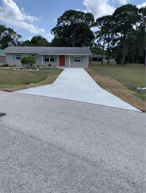 Driveway and walkway to the street by Crete Concepts in Southwest Florida