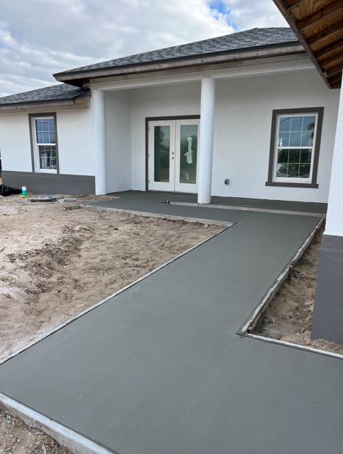 Wraparound backyard patio by Crete Concepts in Southwest Florida