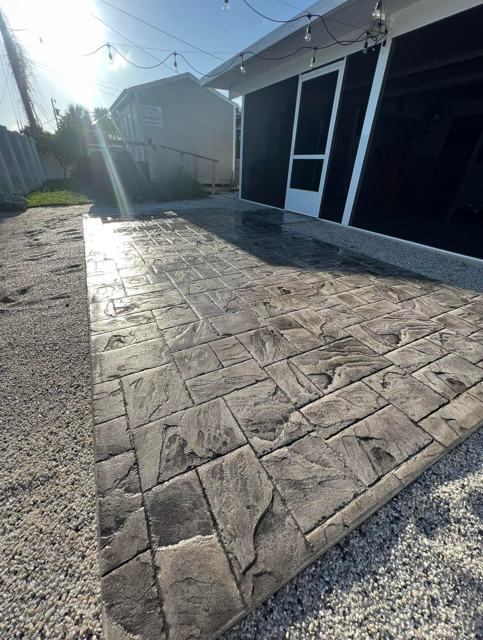 Stamped stone-pattern patio by Crete Concepts in Southwest Florida