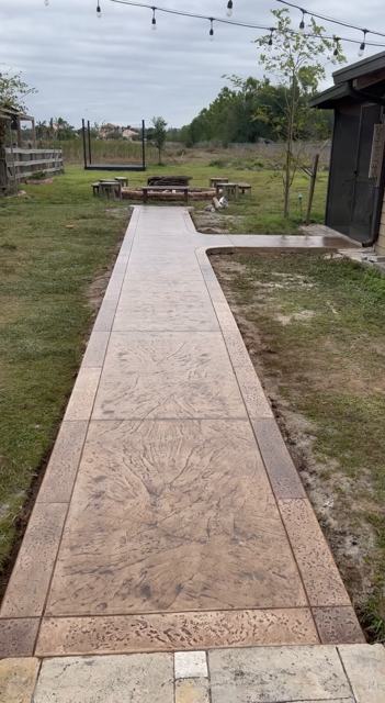 Stamped garden walkway by Crete Concepts in Southwest Florida