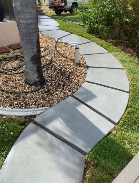 Curved walkway around a tree by Crete Concepts in Southwest Florida
