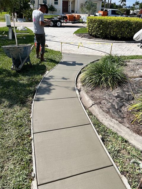 Curved front walkway by Crete Concepts in Southwest Florida