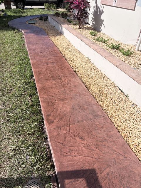 Stamped walkway in red stone by Crete Concepts in Southwest Florida