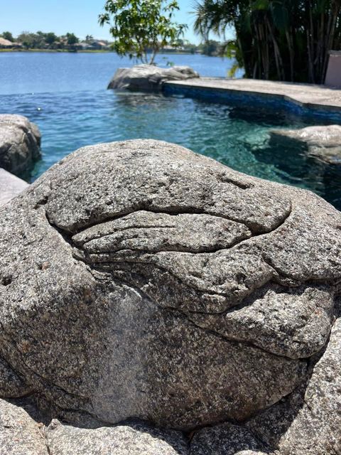 Hand-carved rock at the pool by Crete Concepts in Southwest Florida