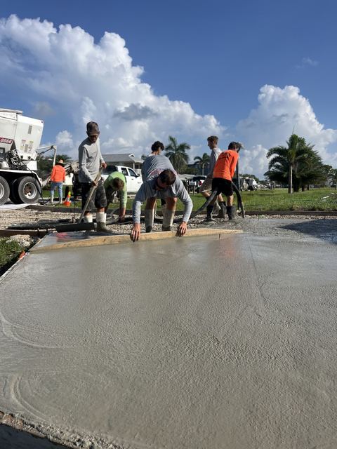 The crew placing a new patio by Crete Concepts in Southwest Florida